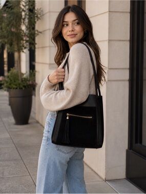 H&M Gorgeous faux leather and suede  bucket style purse. In black.